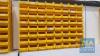 64 No. Yellow Plastic Parts Bins c/w 7 No. Metal Wall Brackets