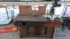 WOODEN WORK BENCH WITH PERFORMED MITE SAW