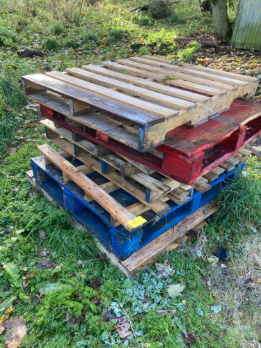 PILE OF WOODEN PALLETS