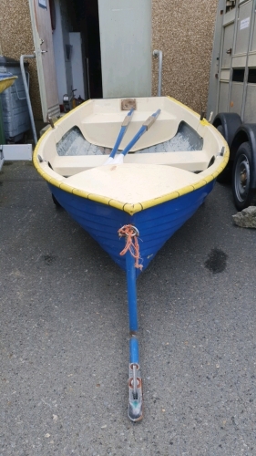 10ft Fibreglass rowing boat C/w oars and launching trailer